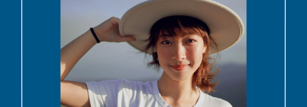 Young woman in a sun hat