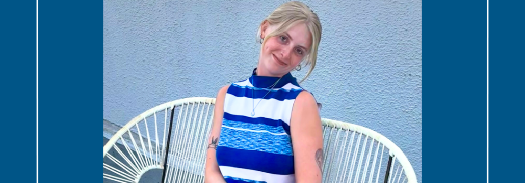 A young woman sitting on a bench