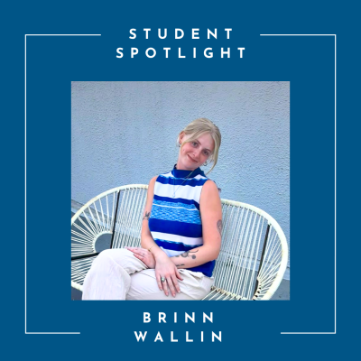 A young blond woman sits on a white wicker bench in front of a gray stucco wall. She is wearing a blue and white sleeveless blouse and and white pants. Her arms are folded in her lap and her hair is loosely pulled back. She is smiling and her head is cocked to the side.