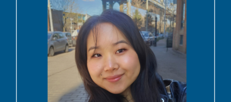 Closeup of young woman standing under an elevated train
