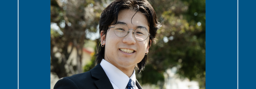 Young man in glasses wearing a blazer