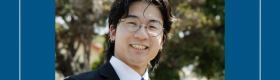 Young man in glasses wearing a blazer