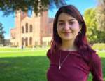 Young woman stands in front of Royce Hall