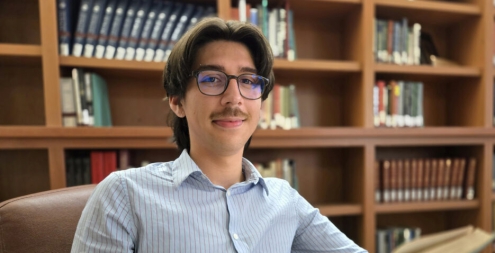 College student reading in a library
