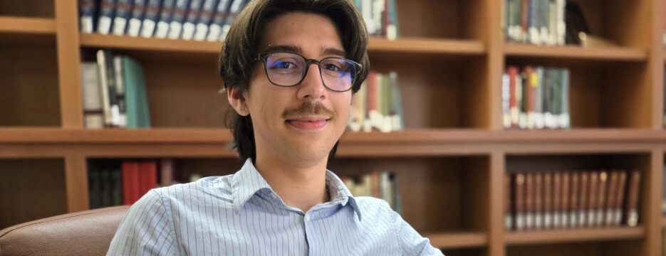 College student reading in a library