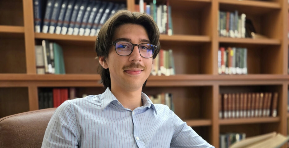 College student reading in a library