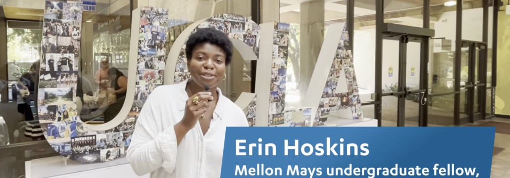 Young woman stands in front of UCLA sign