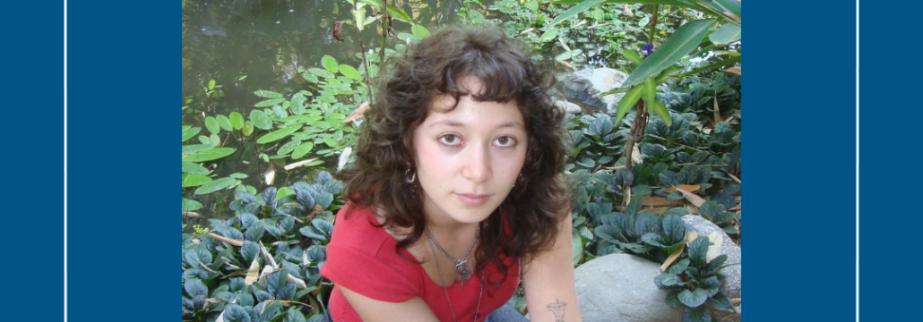 Young woman in a lush garden